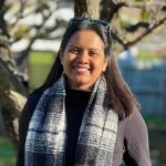 Photo of Anika Saba in front of a tree