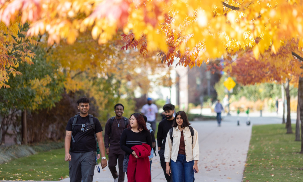UBC Okanagan outdoor picture in fall with students walking down path